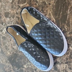 Black quilted slip on shoes